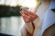 © Vadim - Close up view of woman hands holding phone. Lady texting with phone.