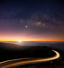 Landscape View Point Asphalt Curved Road On Doi Inthanon National Park Mountains At Dawn With Milky Way Background.