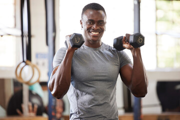 Wall Mural - Fitness, weights and portrait of a black man lifting for muscle, training and power in the gym. Smile, strong and African athlete doing a workout, exercise or sports for body building and cardio