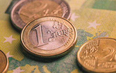 Wall Mural - Pile of euro coins on euro notes