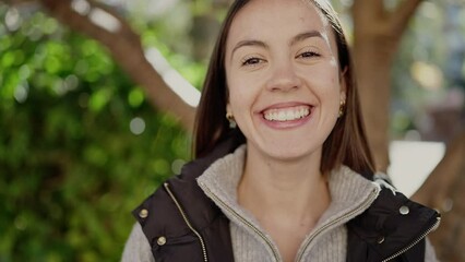 Canvas Print - Young beautiful hispanic woman smiling confident standing at park