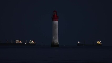 Wall Mural - Phare de Chauvea near Ile de Re with ships to La Rochelle, Pays de la Loire, France
