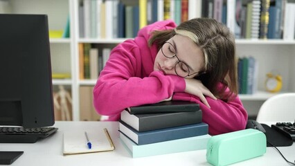 Poster - Young blonde woman student sleeping with head on books at library university