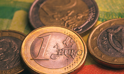 Wall Mural - Pile of euro coins on euro notes