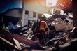 Rescuers in uniform and helmets dismantle the rubble of houses after the earthquake, Generative AI