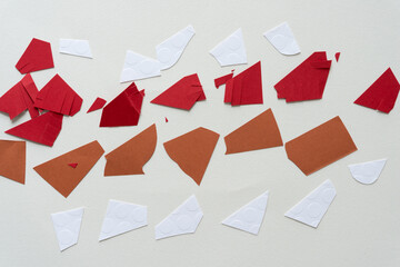 Wall Mural - cut white, red, and brown paper pieces on blank paper