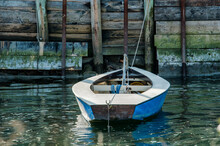 Blue Rowboat On The Dock