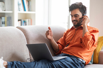 Wall Mural - Middle eastern businessman working from home, have video conference