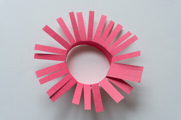 Sticker - red paper ring or daisy wheel with radial fringe isolated on blank paper