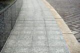 Fototapeta Na drzwi - View on empty stone sidewal. Footpath covering