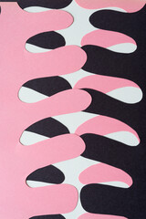 Sticker - layered cut pink and black paper shapes (polyp, columnar, organic, finger, appendage, or ribs) on blank paper