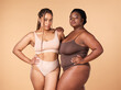© Nina L/peopleimages.com - Portrait, beauty and black women with body positivity, skincare and self love isolated in a studio brown background. Shape, plus size and female models confident in underwear as wellness