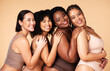 © Nina L/peopleimages.com - Skin care, portrait and diversity women group together for inclusion, natural beauty and power. Happy plus size model friends on beige background for support, makeup glow and underwear body self love