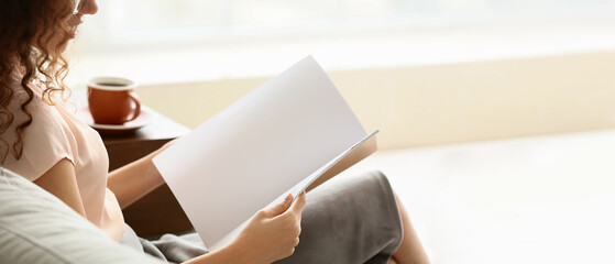 Canvas Print - Young woman reading magazine at home. Banner for design