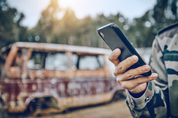 Aufkleber - Smartphone in hand, communication and military person in paintball game outdoor, fitness and technology with mockup space. Chat, online and 5g network with social media, soldier in camouflage uniform