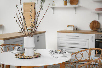 Wall Mural - Vase with willow branches on dining table in kitchen