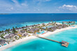 © icemanphotos - Beautiful Maldives paradise. Tropical aerial travel landscape, seascape with wooden bridge, water villas, amazing sea sand sky beach, tropical island nature. Exotic tourism destination summer vacation