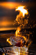 © Cavan Images - Beautiful grilled steak with sparks of fire