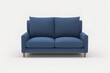 © Rizka - contemporary blue sofa standing alone, complete with cushions, Generative AI