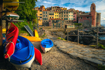 Wall Mural - Colorful kayaks on the storage racks in Tellaro, Liguria, Italy