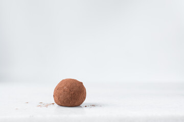 Sticker - chocolate truffles covered in cocoa powder, homemade chocolate bonbons on white background