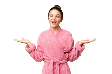 Sticker - Teenager girl in a bathrobe over isolated chroma key background with shocked facial expression