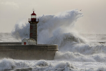 Wall Mural - Big wave splash in the old lighthouse