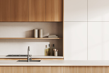 Light kitchen interior with bar countertop, washbasin and kitchenware