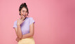 © NaMong Productions - Young Asian teenage girl surprised excited isolated on pink background.