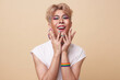 © NaMong Productions - Youth asian transgender LGBT looking at camera while posing isolated over nude color background.