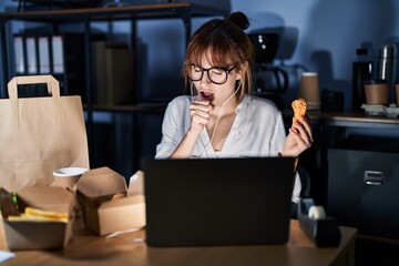 Poster - Young beautiful woman working using computer laptop and eating delivery food feeling unwell and coughing as symptom for cold or bronchitis. health care concept.