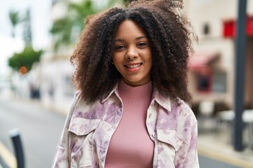 Canvas Print - Young african american woman smiling confident standing at street