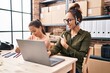© Krakenimages.com - Young mother and daughter working at the office and doing homework smiling happy pointing with hand and finger