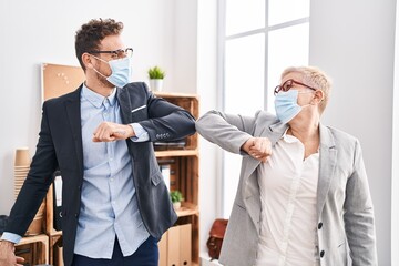 Sticker - Mother and son business workers wearing medical mask make elbow greeting at office