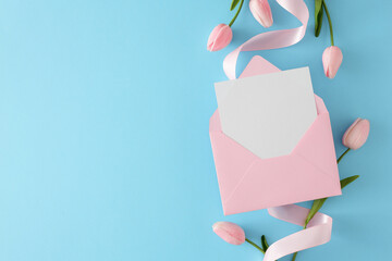 Wall Mural - Hello spring concept. Top view photo of pink envelope with letter, tulips flowers and silk ribbon on blue background with copyspace. Invitation card idea.