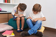 © Krakenimages.com - Brother and sister students writing on notebook studying at library school