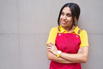 Poster - Young beautiful arab woman waitress smiling confident standing with arms crossed gesture over isolated white background