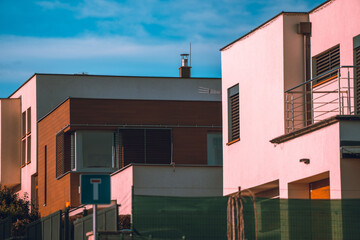 Pink houses with sky in the background