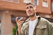 © Krakenimages.com - Young hispanic man talking on the smartphone at street