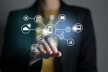 Woman pushing virtual screen with many social and functional icons of mobile apps. Multitasking in hands concept