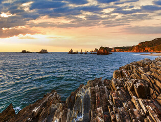 Canvas Print - Evening Atlantic ocean coastline landscape. Beautiful Gueirua beach with sharp islets. Asturias, Spain.