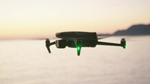 Montenegro, january 2023: camera drone mavic 3 hover over the sea, after sunset