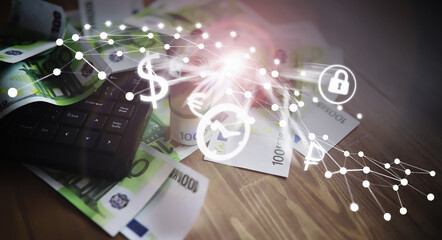 The work of a programmer and blogger on the Internet. Computer keyboard and a scattering of 100 euro bills on the table.
