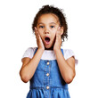© peopleimages.com - An adorable little girl looking shocked with her hands on her cheeks. Surprised and amazed kid speechless in awe isolated on a png background.
