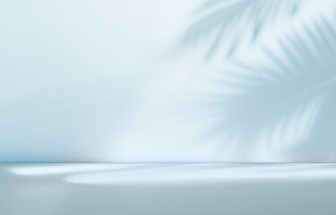 blurred shadow from palm leaves on the light blue wall. minimal abstract background for product pres