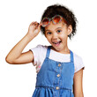 © peopleimages.com - A mixed race girl wearing funky sunglasses isolated on a png background. Happy and carefree kid with an imagination for being a fashion model.