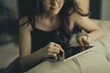 © Cavan Images - young asian woman study with tablet at home