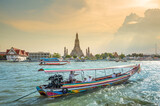 Fototapeta Desenie - raditional public boat in Chao phraya river sightseeing near wat Arun on beautiful day; Water Transportation Thailand