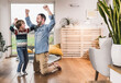 © Westend61 - Happy father and son having fun and dancing at home