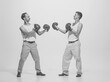 © Lustre Art Group  - Vintage portrait of two retro men boxing in gloves. Funny image of two friends. Sport, retro fashion style art photography